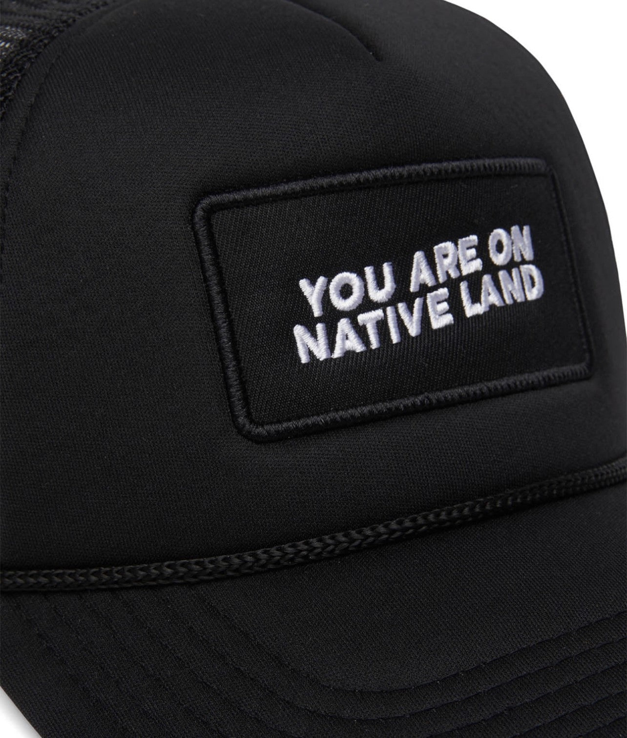 'YOU ARE ON NATIVE LAND' TRUCKER HAT